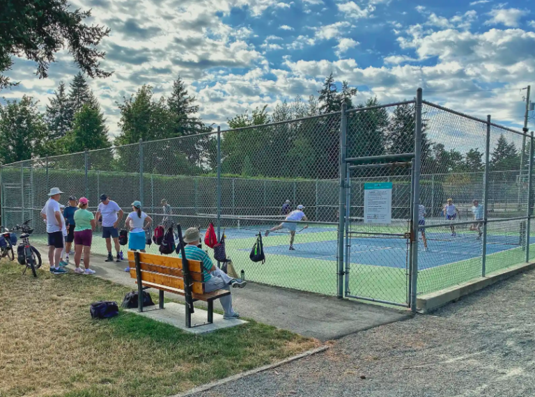Residents playing pickleball and gathering beside the courts at Saltair Centennial Park